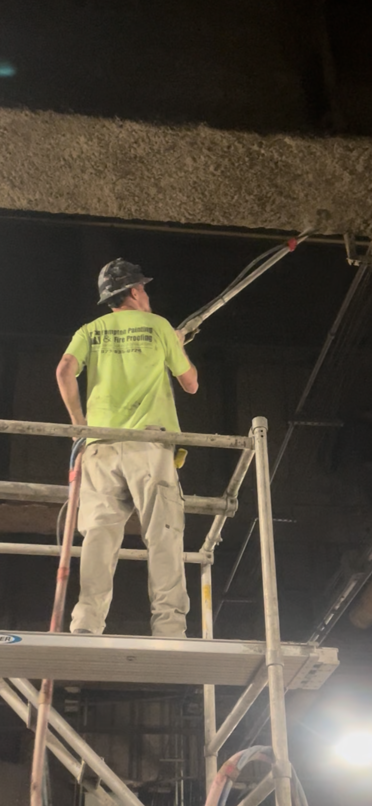Worker Spraying Fireproofing